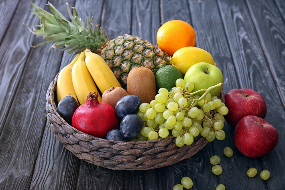 Basket,And,Fresh,Fruits,On,Wooden,Table