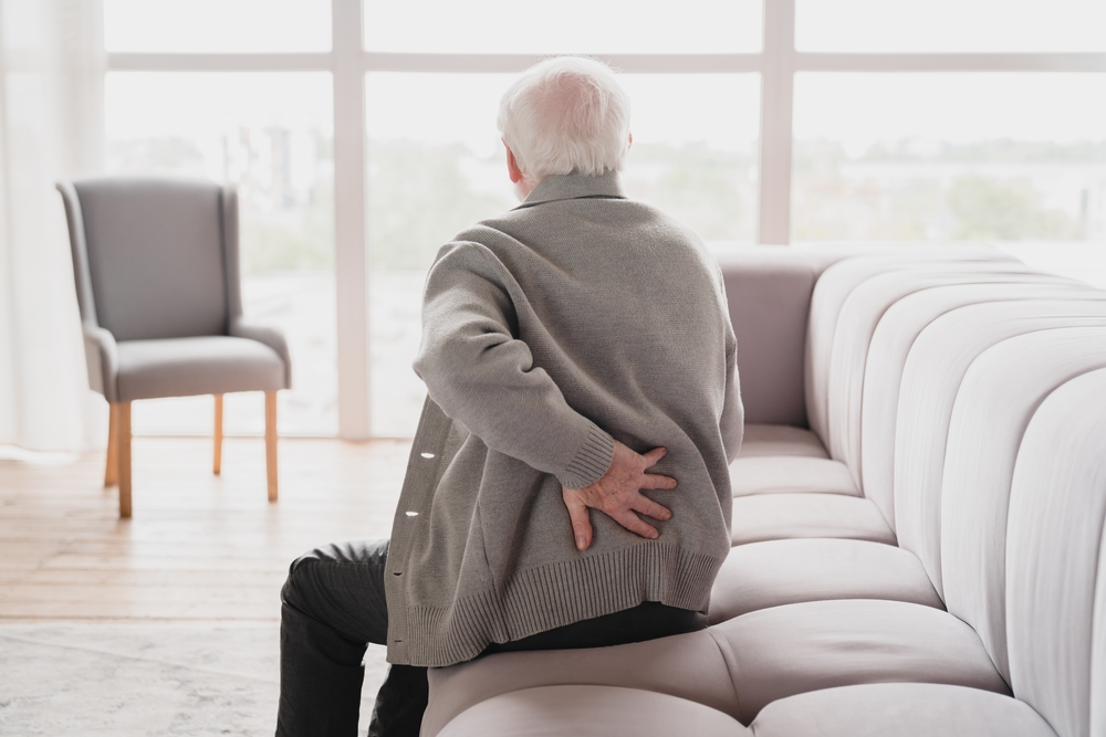 Senior,Old,Elderly,Man,Grandfather,Touching,His,Back,,Suffering,From